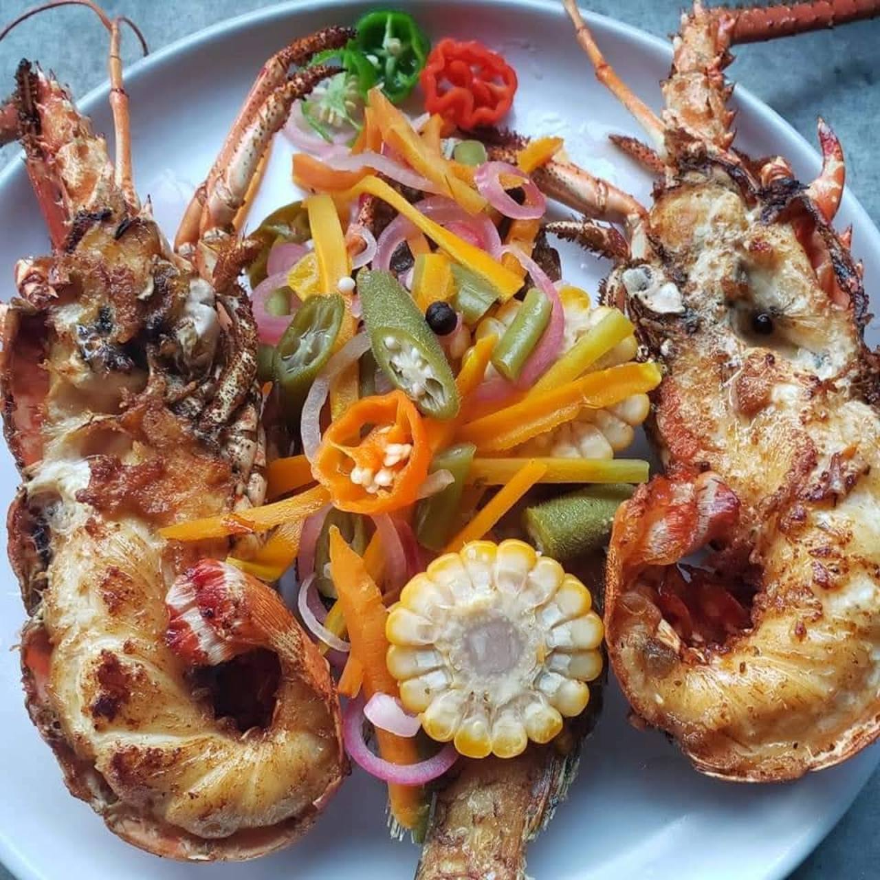 Grilled Lobster & Escovitch prepared by Steakaville Rest Stop