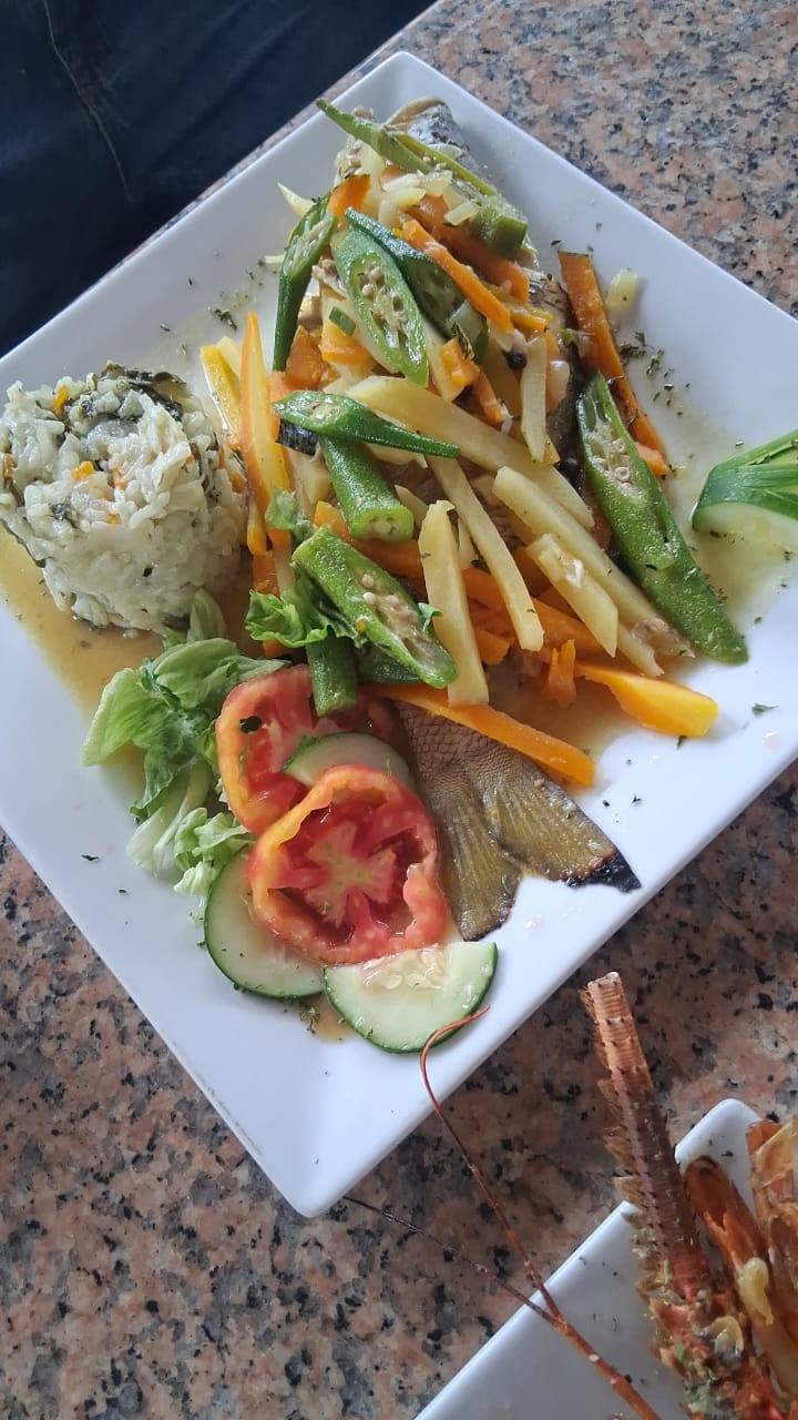 Steamed Fish & Callaloo Rice prepared by Steakaville Rest Stop